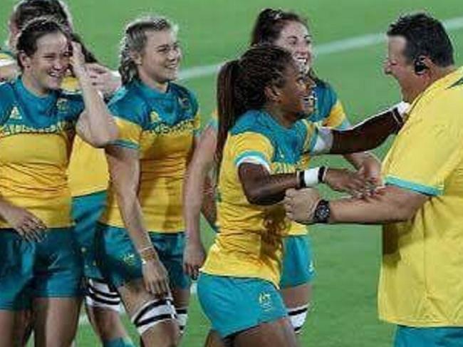 John Manenti congratulates the womens sevens team after they win gold -- very small file size -- only good for inset