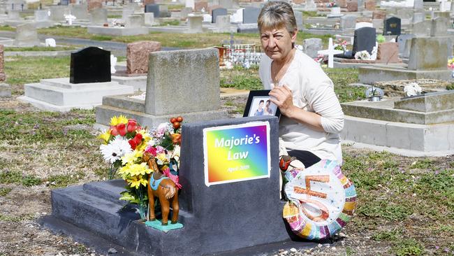 Rosemary, the mother of transgender woman Marjorie Harwood who died in July 2018, pictured at her daughter's grave. Picture: MATT THOMPSON