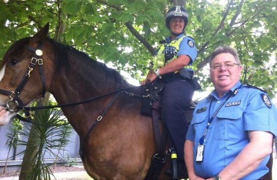 Murray Smalpage with a mounted policewoman in 2014. Picture: Phil Hickey