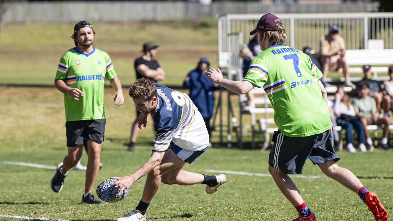 Ben Glasby scores for Cowboys during the All Ages All Abilities Toowoomba Touch grand final at Kearneys Spring Sporting Complex. Picture: Kevin Farmer