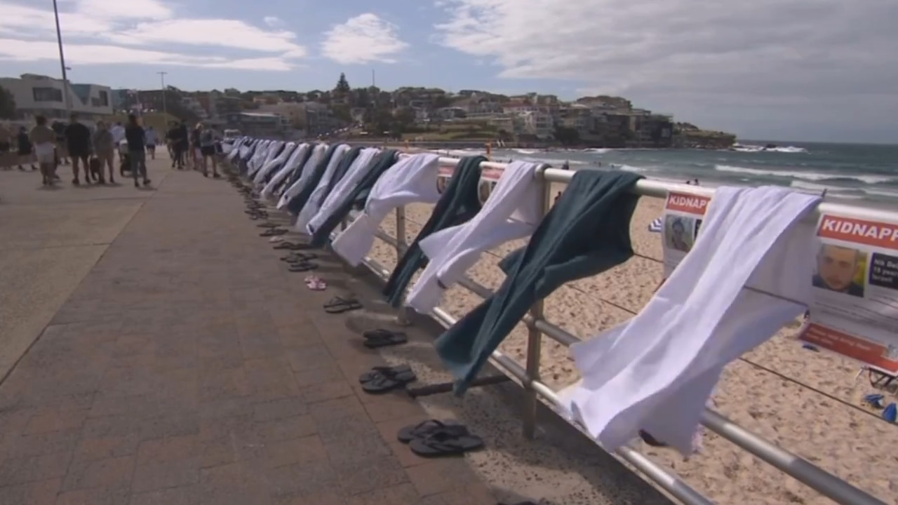 Two men attempted to destroy Jewish kidnap posters at hostage memorial in Bondi