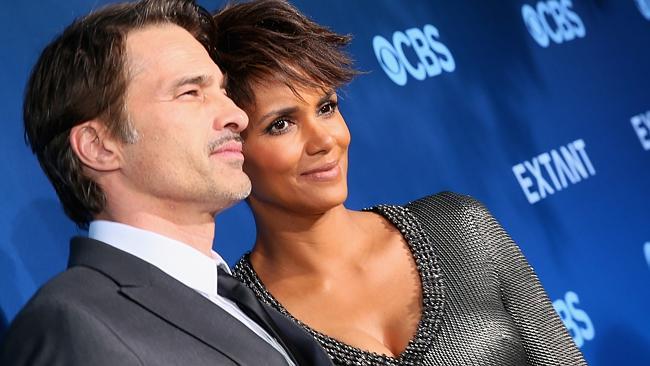 LOS ANGELES, CA — JUNE 16: Actors Olivier Martinez (L) and Halle Berry attend Premiere Of