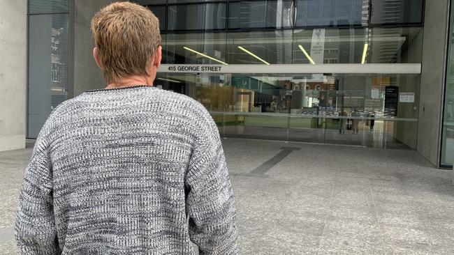 Shane walks into Brisbane District Court for the sentence of Kern Urban, who abused him when he was 10.