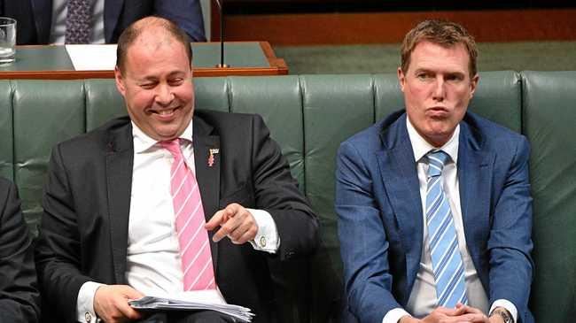 ALL SMILES: Treasurer Josh Frydenberg, left, has delivered a budget being lauded by some, but hides plenty of harsh measures. Picture: MICK TSIKAS