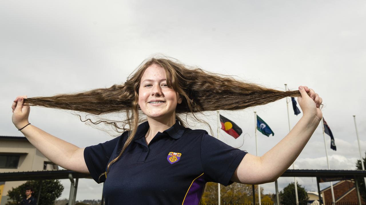 St Josephs College student Sophie Wagner prepares to cut her hair in Shave for a Cure, Friday, August 12, 2022. Picture: Kevin Farmer