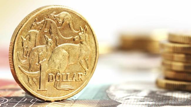 Aussie one dollar coins, on a twenty dollar note.