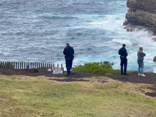 Police on Friday morning as they scour Vaucluse clifftop