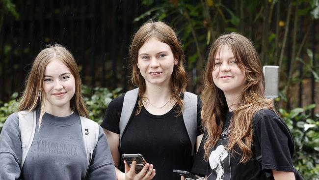 Students Isabella Mead, Lucy Cooper, and Ella Campbell pictured at QUT Gardens Point. Pic: Josh Woning.