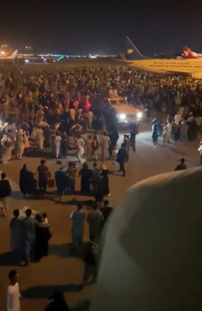 Screengrabs from Kabul International Airport as people flood the runway. Picture: Twitter