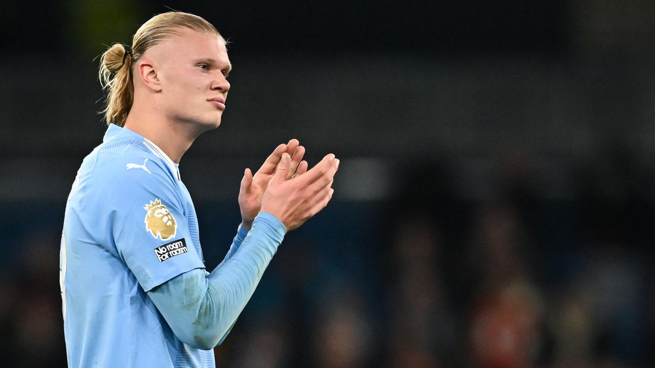 Erling Haaland applauds at the end of the game. (Photo by Paul ELLIS / AFP)