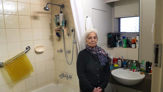 Albertina Martins, 81, has suffered four falls from having to step over the ledge of her bath into the shower in her South Melbourne flat. Picture: David Crosling