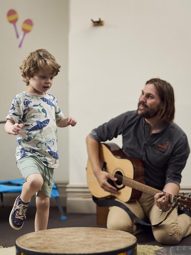 Arlo has learnt to talk with help from his music therapist Rowan Harding. Picture: Matt Loxton