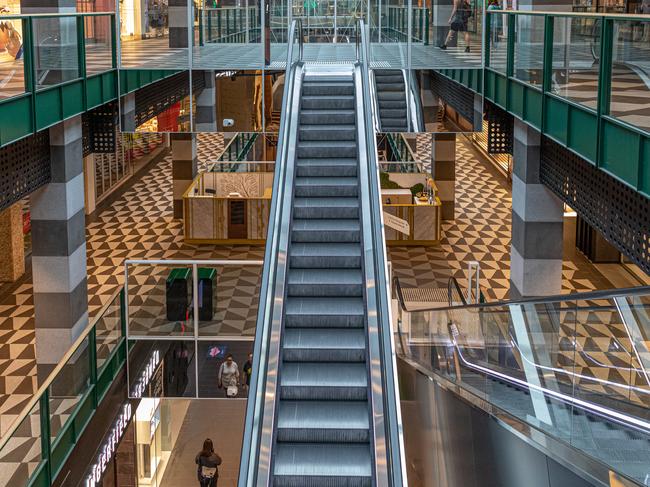 MELBOURNE, AUSTRALIA - MARCH 29: Empty escalators and shopping floors at a shopping mall  on March 29, 2020 in Melbourne, Australia. All international arrivals into Australia from midnight on Saturday will be placed into mandatory quarantine in hotels for 14 days as the Federal Government increases restrictions to stop the spread of COVID-19.  All libraries, museums, galleries, beauty salons, tattoo parlours, shopping centre food courts, auctions, open houses, amusement parks, arcades, indoor and outdoor play centres, swimming pools are closed and indoor exercise activities are now banned. This is in addition to the closure of bars, pubs and nightclubs which came into effect on Monday. Restaurants and cafes are restricted to providing takeaway only. Weddings will now be restricted to five people including the couple while funerals are limited to 10 mourners. All Australians are now expected to stay at home except for essential outings such as work, grocery shopping and medical appointments. Exercising outdoors alone is still permitted. Australia now has more than 3,600 confirmed cases of COVID-19 while the death toll now stands at 16. (Photo by Asanka Ratnayake/Getty Images)