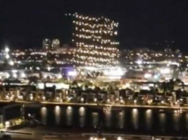 In videos posted to social media, drones were seen falling out of formation and into the Yarra River in Docklands on Friday night. Pictures: Channel 9