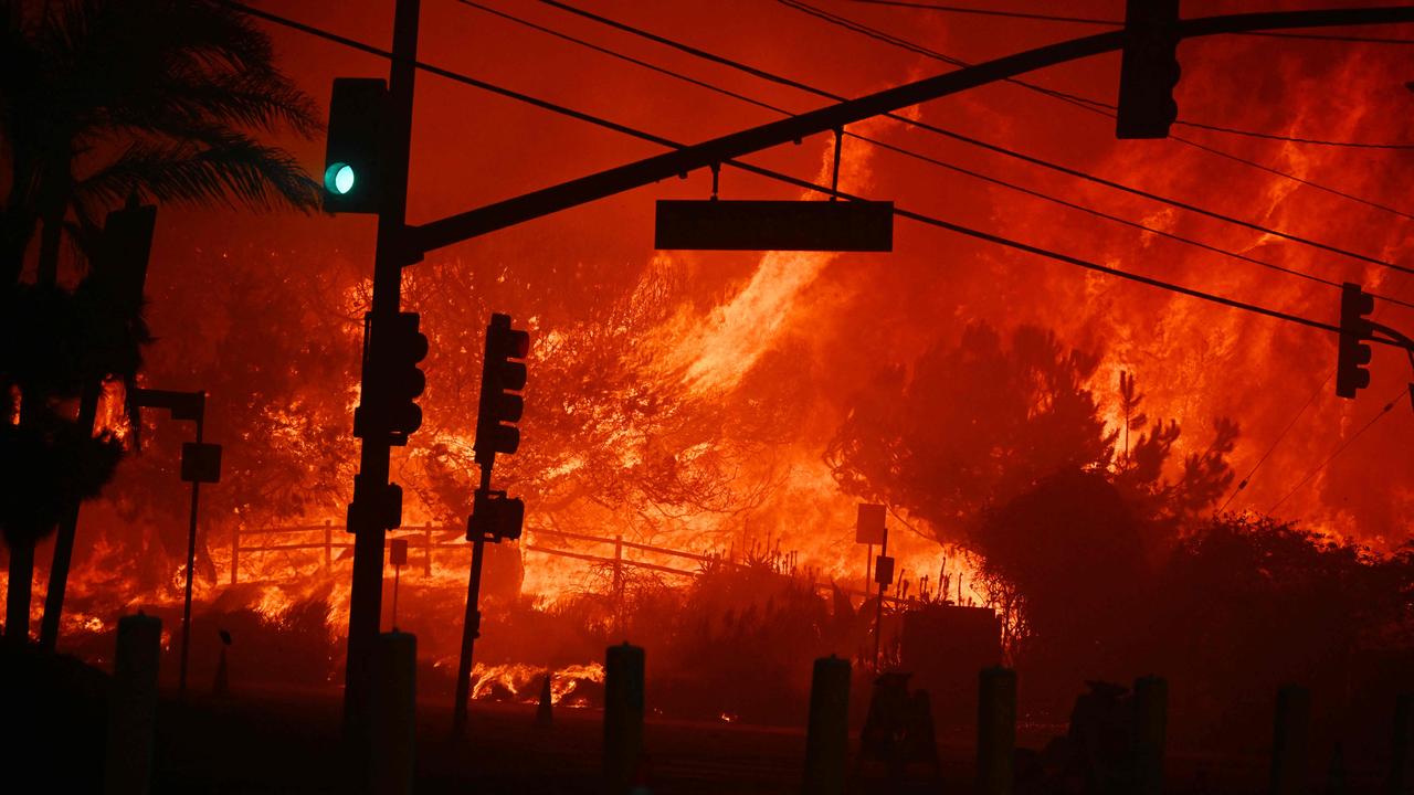 Flames overtake the intersection of Temescal Canyon and Pacific Coast Highway.