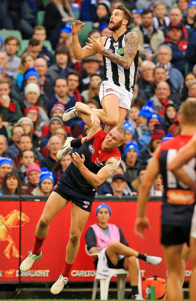 Jeremy Howe takes a huge mark over Tom McDonald. Picture: Mark Stewart