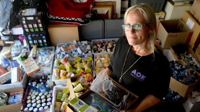 Sarah Morris in her garage at Warriewood full of food taken from hotel quarantine rooms which are then distributed throughout homeless shelters. Picture: NCA NewsWire / Jeremy Piper