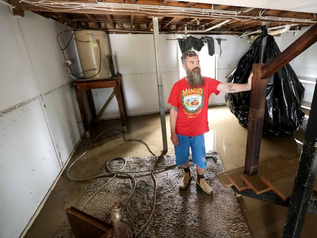 Anthony Blaslov, about to start the clean-up and hose out his down stairs rooms, on Videroni st Bundamba. Picture: Steve Pohlner