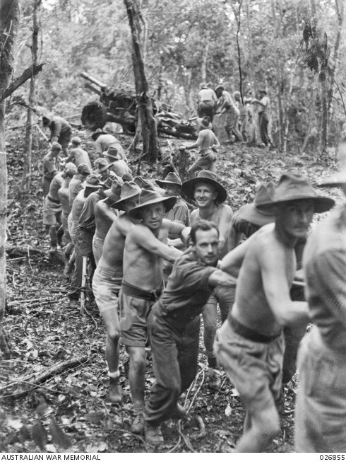 Kokoda trail image from Australian War Memorial: Sapper Ernie Chester Walker is fourth on left wearing a hat, shorts and belt.