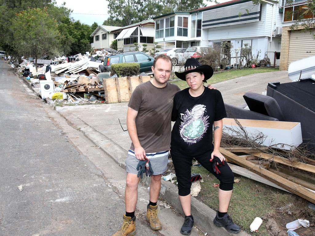 Dean Brown and Louise Bareham finishing their flood clean-up on Logan Ave, Oxley, in Brisbane’s southwest. Picture: Steve Pohlner