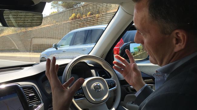 Volvo's Trent Victor chats at the driver’s seat of the autonomous Volvo XC90