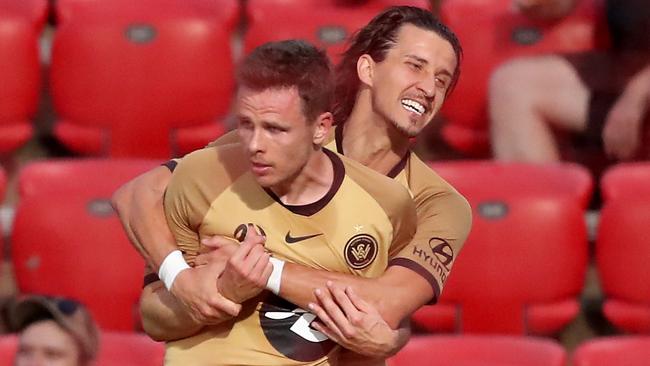 Western Sydney Wanderers fullback Daniel Georgievski hugs teammate Nicolai Muller after Muller scored against Adelaide. Picture: AAP