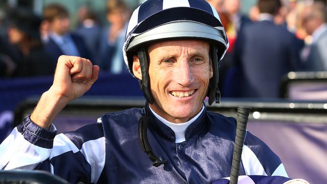 Damien Oliver after winning the last race of the Flemington carnival. Picture: Getty Images