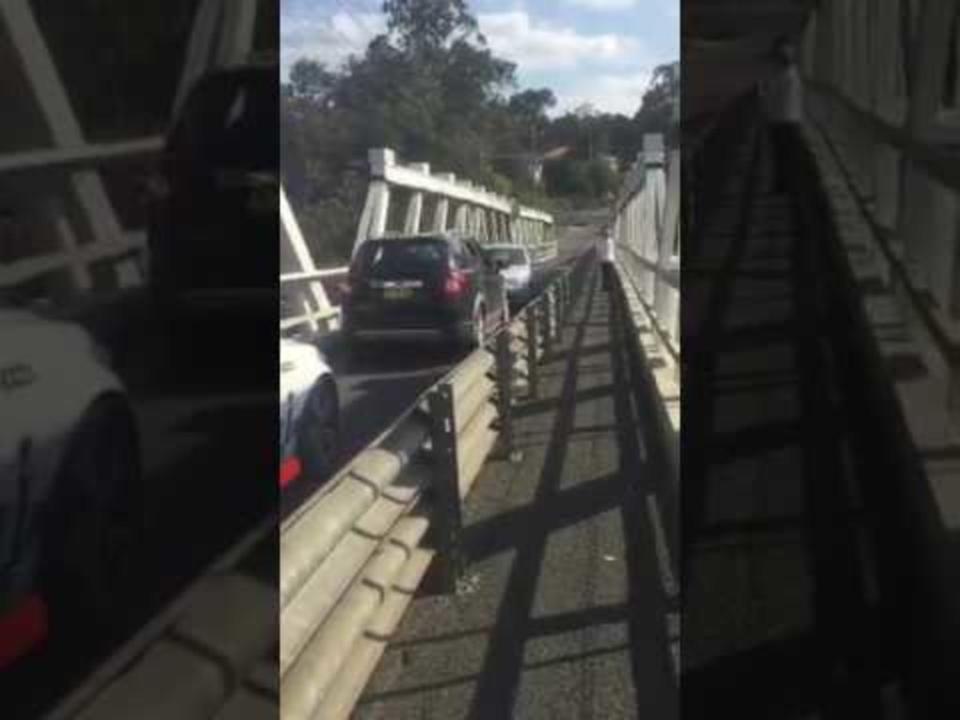 Two Cars Get Into a Standoff on Bridge   