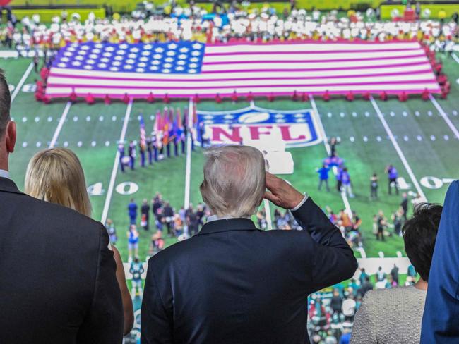 US President Donald Trump salutes as the national anthem is played before the start of Super Bowl LIX between the Kansas City Chiefs and the Philadelphia Eagles at Caesars Superdome in New Orleans, Louisiana, February 9, 2025. (Photo by ROBERTO SCHMIDT / AFP)