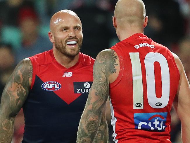 Melbourne's Nathan Jones and his brother Sydney's Zak Jones come together during AFL match between the Sydney Swans and Melbourne Demons at the SCG. Picture. Phil Hillyard