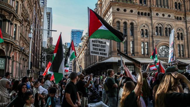 Protesters march through the Sydney CBD on October 6, 2024. (Photo by Roni Bintang/Getty Images)