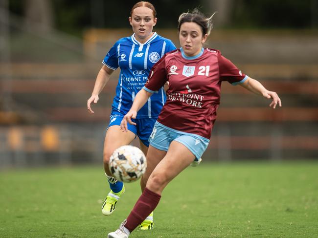 Olympic defender Mali Stanton coming up behind Kaitlin Kiparizov. Picture: Julian Andrews