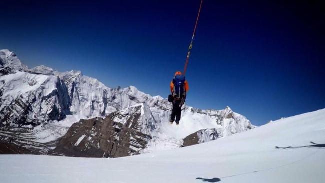 Spectacular scenery, spectacular risk: Lowering the longline rescuer. Picture: Foxtel