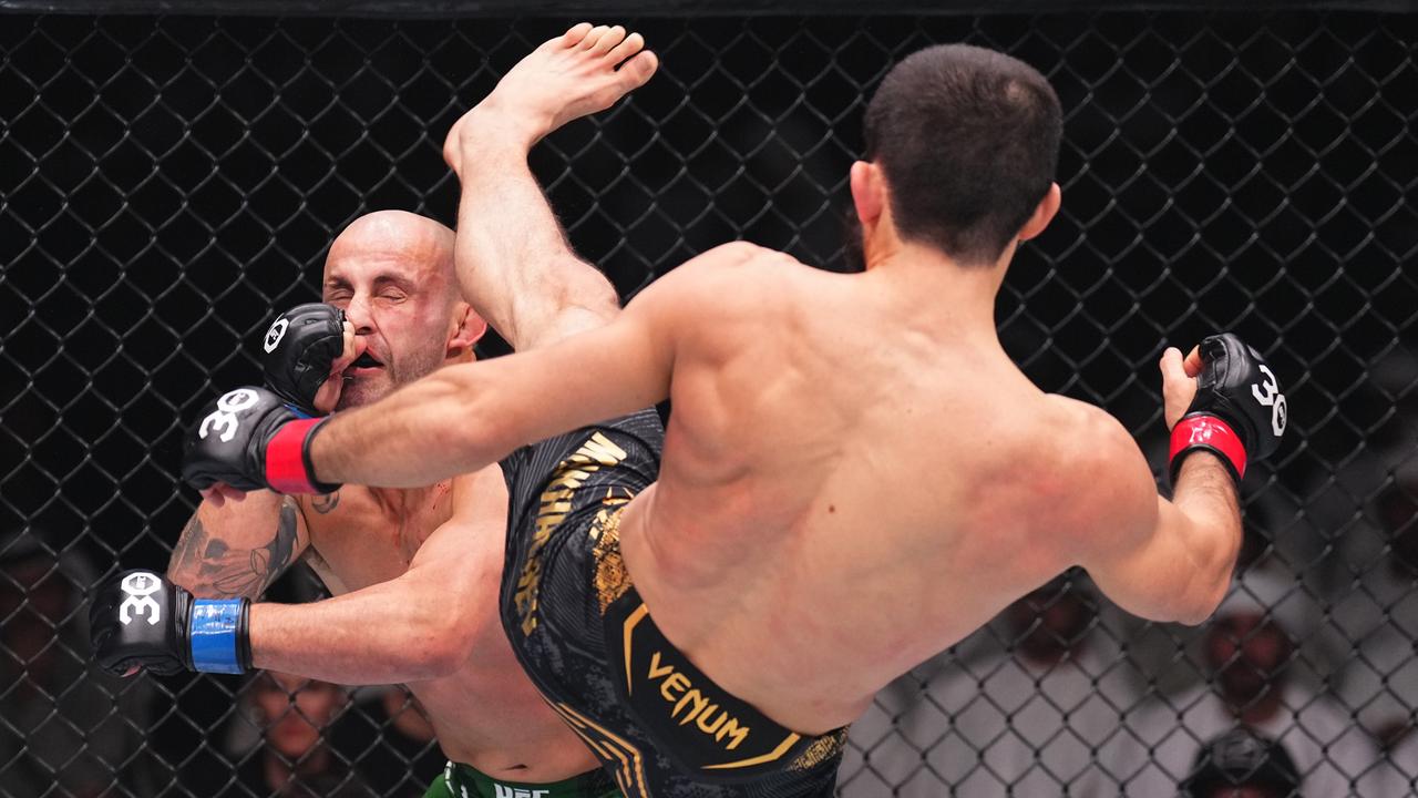 Islam Makhachev of Russia kicks Alexander Volkanovski of Australia in the UFC lightweight championship fight during the UFC 294 event.
