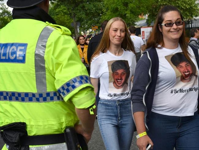 Fans wearing T-shirts bearing a tribute to Martyn Hett, a victim of the May 22 terrorist attack, arrive at at the Old Trafford Cricket Ground ahead of the One Love Manchester tribute concert in Manchester on June 4, 2017. Picture: Anthony Devlin/AFP