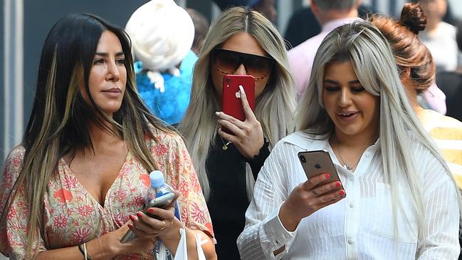 Witnesses Shanae Pericic (centre) and Brittany McGuire (right) arrive to the Melbourne Magistrates Court in Melbourne. Picture: AAP