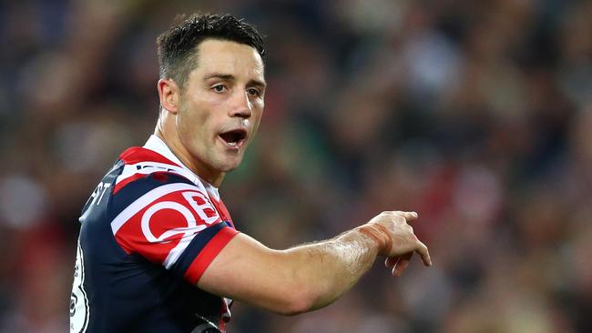 Cooper Cronk of the Roosters talks to teammates during the 2018 NRL Grand Final.