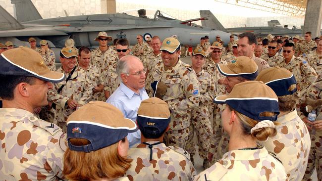 John Howard meets Royal Australian Air Force personnel serving in the Middle East on Operation Falconer in May 2003.