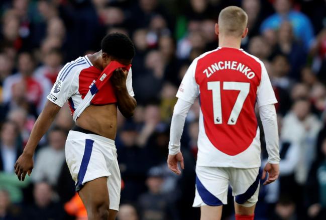 Arsenal's Myles Lewis-Skelly (L) reacts after being sent off against West Ham