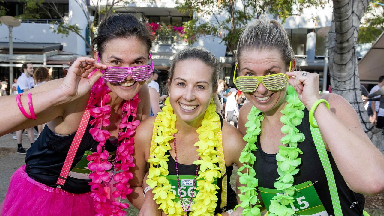 Annabel Kolkka from Broadbeach, Sarah Croft from Robina and Lisa McMillan from Broadbeach at Bridge to Brisbane 2019 at South Bank, Sunday, August 25, 2019 (AAP Image/Richard Walker)