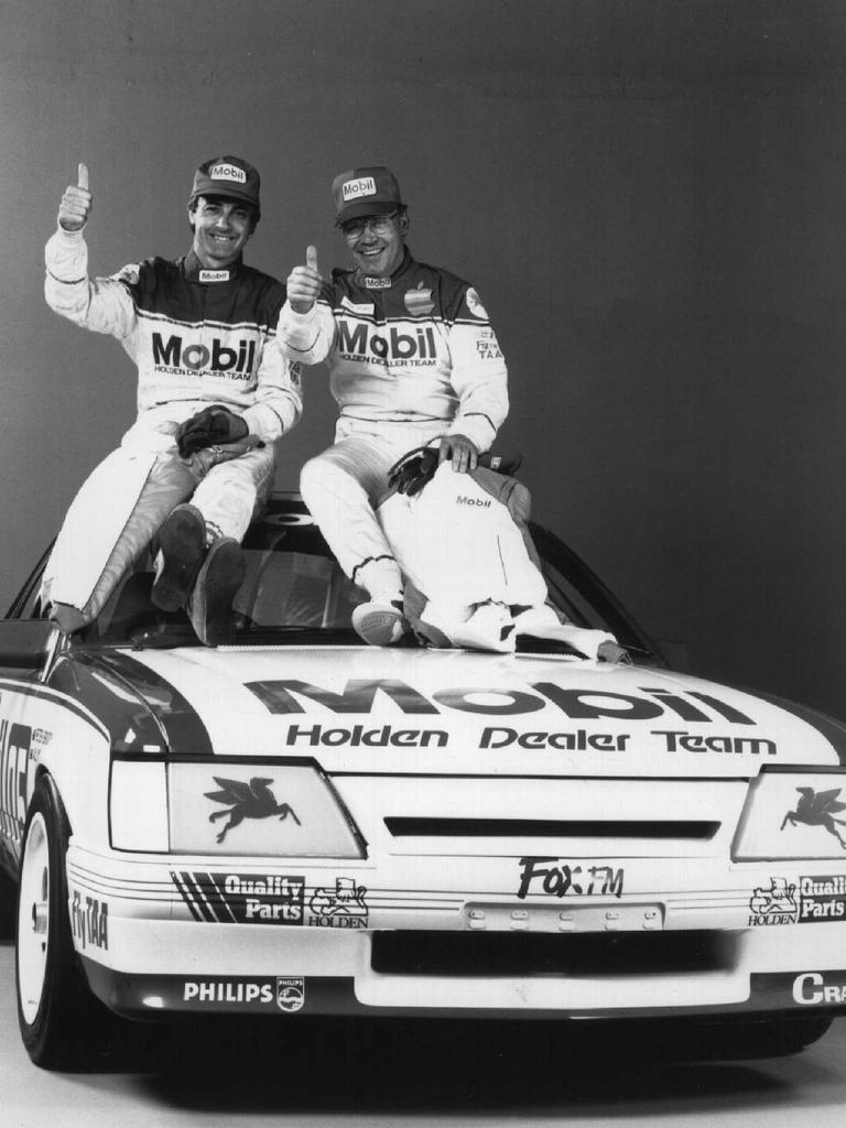 Drivers Peter Brock and Allan Moffatt with 1986 V8 Holden Commodore car. Picture: Supplied