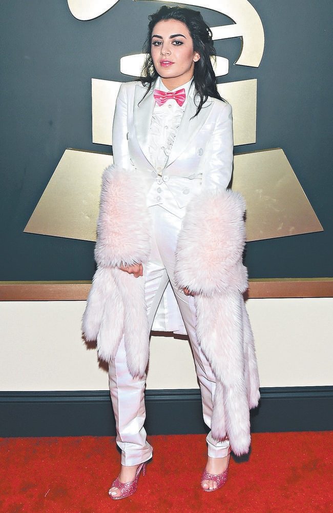 Charli XCX covered up with this white and pink outfit.