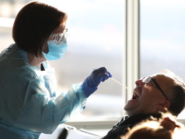 SYDNEY, AUSTRALIA NewsWire Photos JUNE 7: NSW Health workers and NSW Police were inside the T2 terminal at Sydney Airport this afternoon to perform Covid testing on passengers arriving on a flight from Melbourne. Picture: NCA NewsWire/David Swift