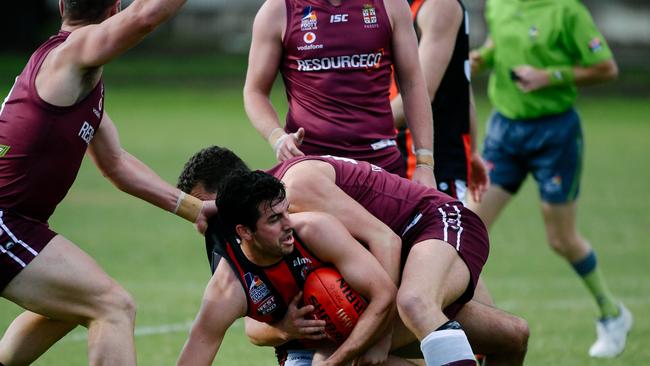 Rostrevor Old Collegians’ Kieran Holland with the ball on the ground during his side’s division one Adelaide Footy League clash with Prince Alfred Old Collegians on Saturday. Picture: AAP/Morgan Sette