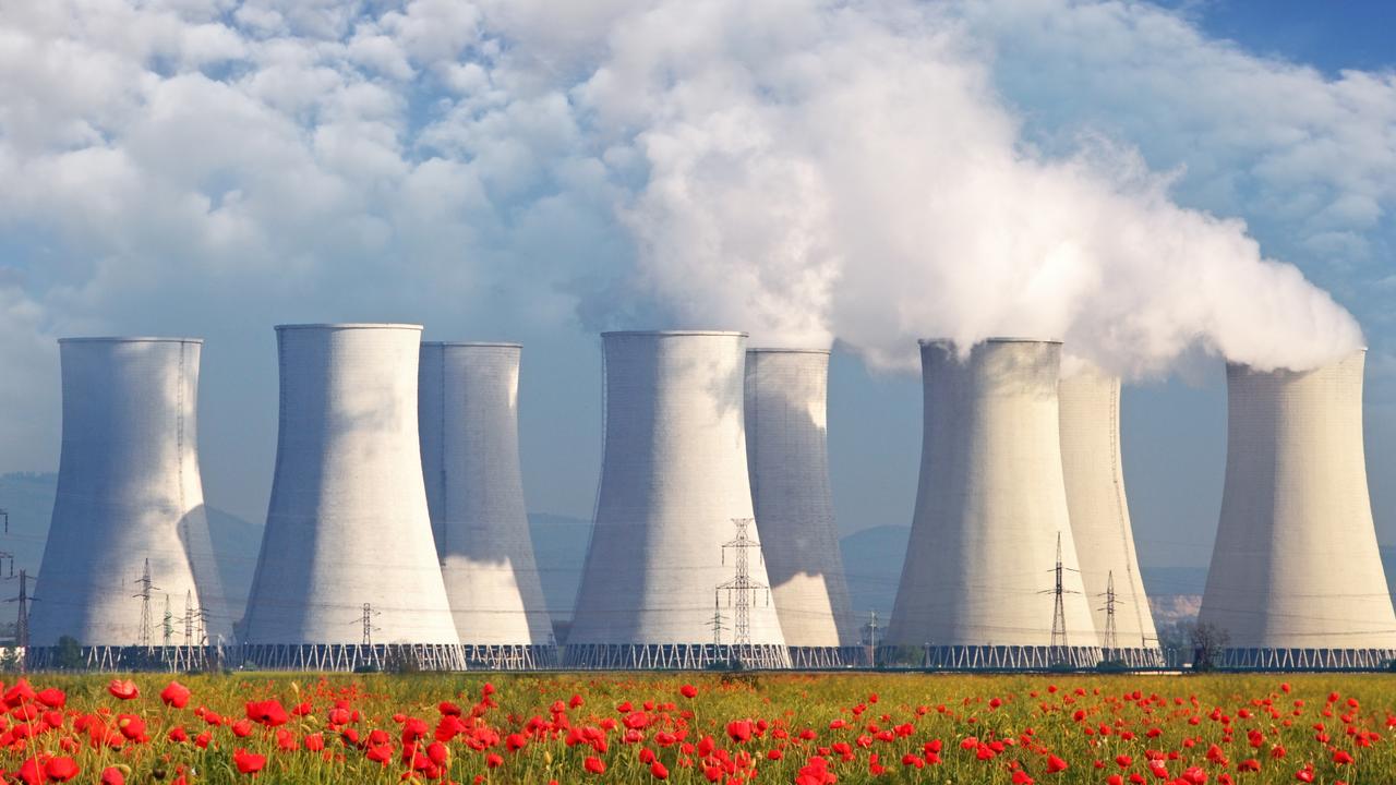 Nuclear Power plant with red field and blue sky