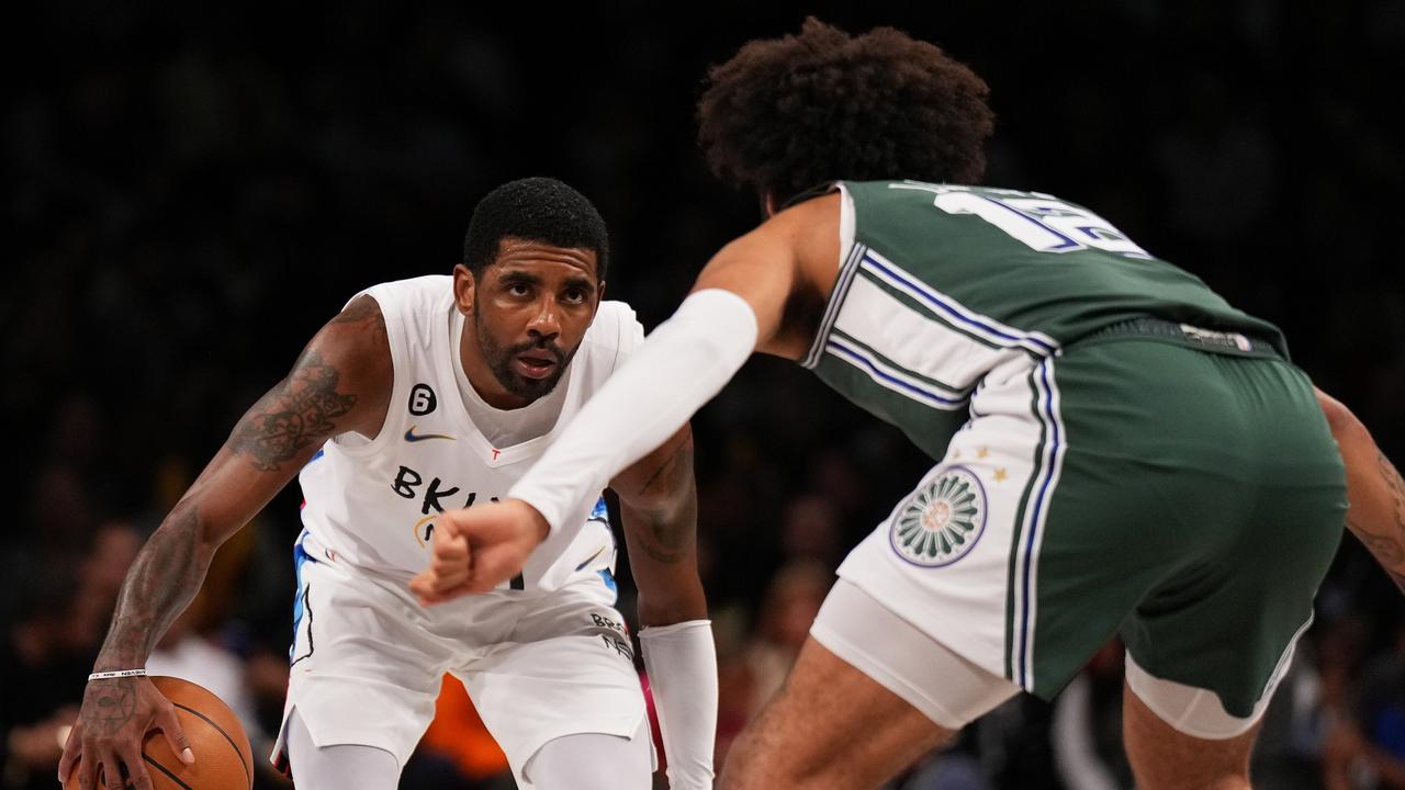 Kyrie Irving #11 of the Brooklyn Nets drives to the basket against Isaiah Livers #12 of the Detroit Pistons during the game at Barclays Center on January 26, 2023 in New York City.