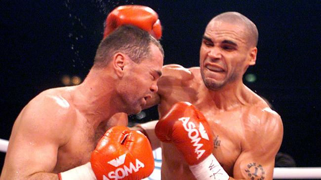 Anthony Mundine lands a punch on Sven Ottke during their 2001 fight.