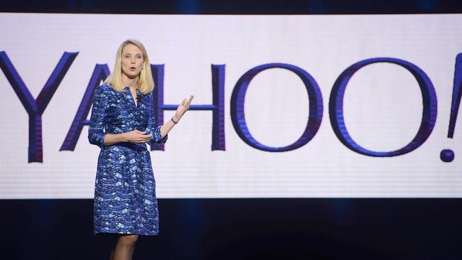 (FILES) This file photo taken on January 07, 2014 shows Yahoo CEO Marissa Mayer speaking during her keynote address at the 2014 International CES in Las Vegas, Nevada. Yahoo on February 2, 2016 said it is cutting 15 percent of its workforce and narrowing its focus as it explores "strategic alternatives" for what to do with the faded Internet star. The announcements came as the California company reported a loss of $4.43 billion in the final three months of last year, due mostly to lowering the value of its US, Canada, Europe, Latin America and Tumblr units. / AFP / ROBYN BECK