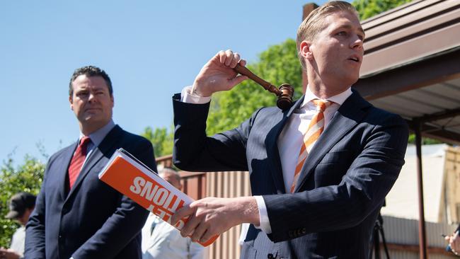 Auctioneer Jake Moore bring the hammer down at the end of the auction of 166 Baptist Street, Redfern in Sydney. Picture: James Gourley