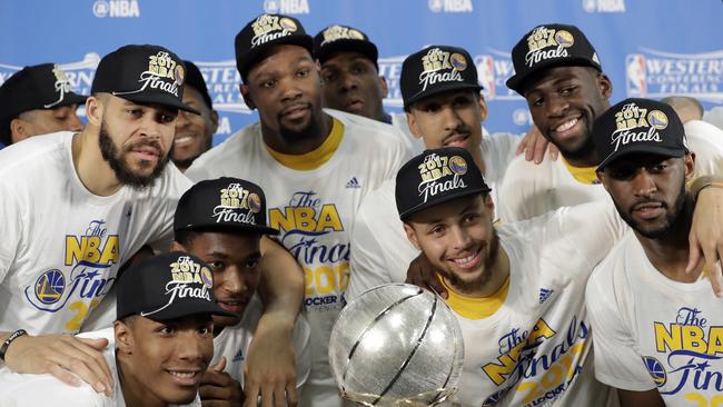 Golden State Warriors celebrate winning the NBA basketball Western Conference finals.